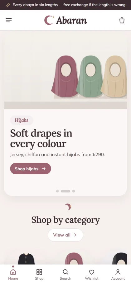 Abaran Islamic clothing website on a mobile phone with a hijab slide and shop by category